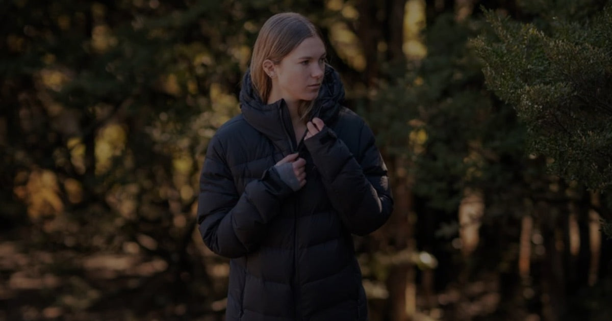 Woman wearing the Main Divide Ranger Down Puffer Jacket in the New Zealand outdoors